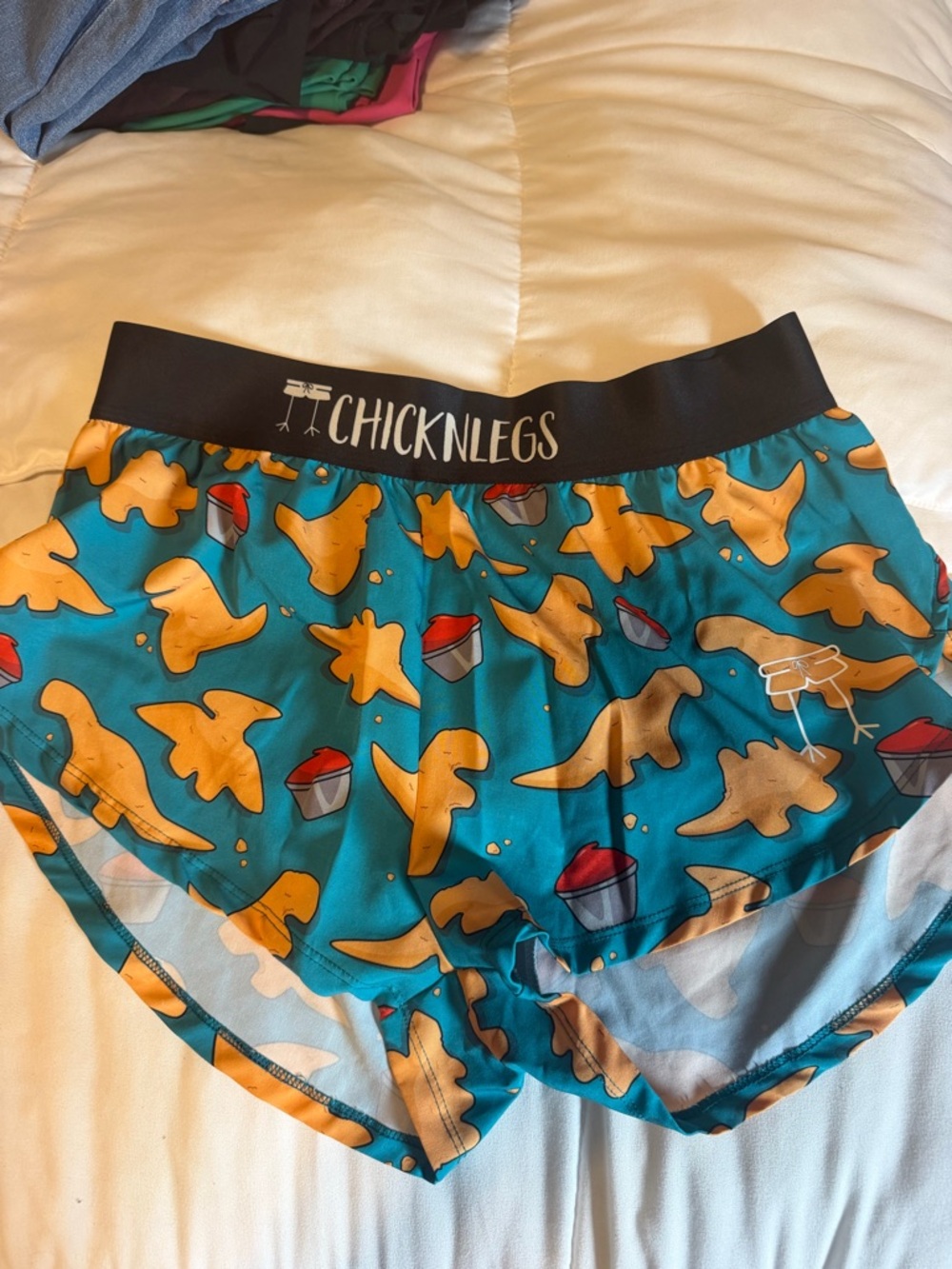 CHICKNLEGS Women's Teal Athletic Shorts with Yellow Chick Pattern
